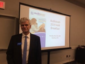 Audioscan President Jim Jonkman gets ready to address the crowd at the company's annual breakfast for special equipment distributors on Thursday morning.