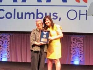 Pediatric audiology expert and author Jane Madell is presented with a Presidential Award by Dr Christensen.