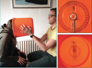 Figure 1a-c. A) Administering the “Bucket Test”; B) View from back of bucket; C) View from inside the bucket. (Photos courtesy of Dr Michael Maslin, Interacoustics Academy, Interacoustics, Middelfart, Denmark.)